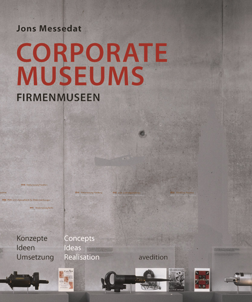 Products on plinths, concrete wall behind, on cover of 'Corporate Museums, Concepts, Ideas, Realisation', by Avedition Gmbh.