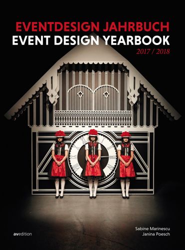 Gaggenau restaurant with three girls in red and black dresses, on cover of 'Event Design Yearbook 2017/2018', by Avedition Gmbh.