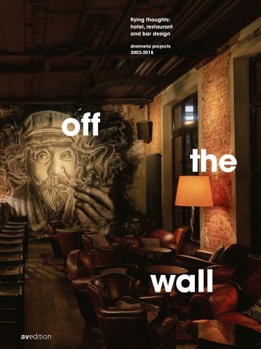 off the wall flying thoughts: hotel, restaurant and bar design. Dreimeta 2003-2018 in white font, on dark lit interior space, sailor smoking pipe