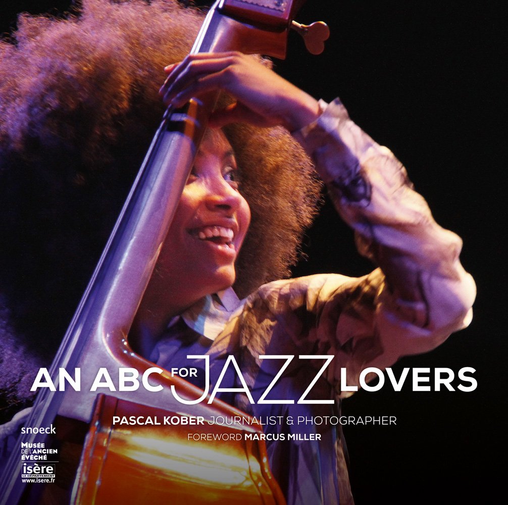 Esperanza Spalding on stage playing double bass with An ABC for Jazz Lovers in white font below