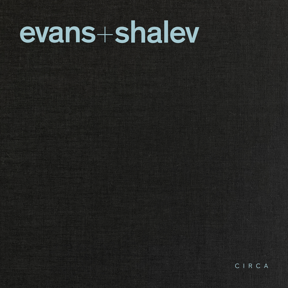 Pale blue font to top left of black cover of 'Evans + Shalev', by Circa Press.
