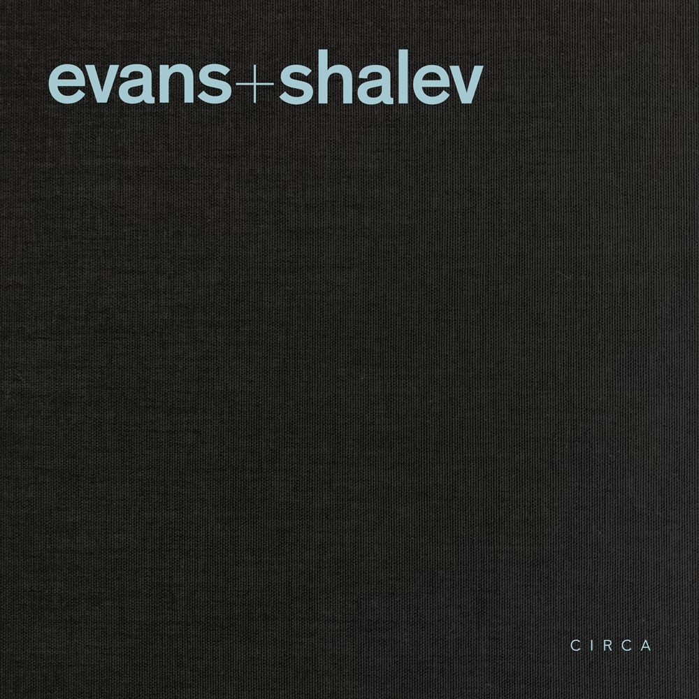 Pale blue font to top left of black cover of 'Evans + Shalev', by Circa Press.