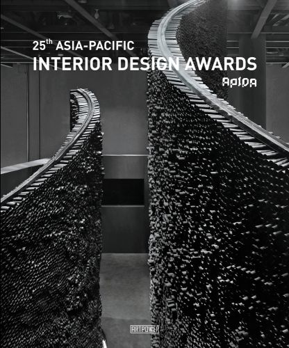 Curved wall made of small black tubing, 25TH ASIA-PACIFIC INTERIOR DESIGN AWARDS in white font above