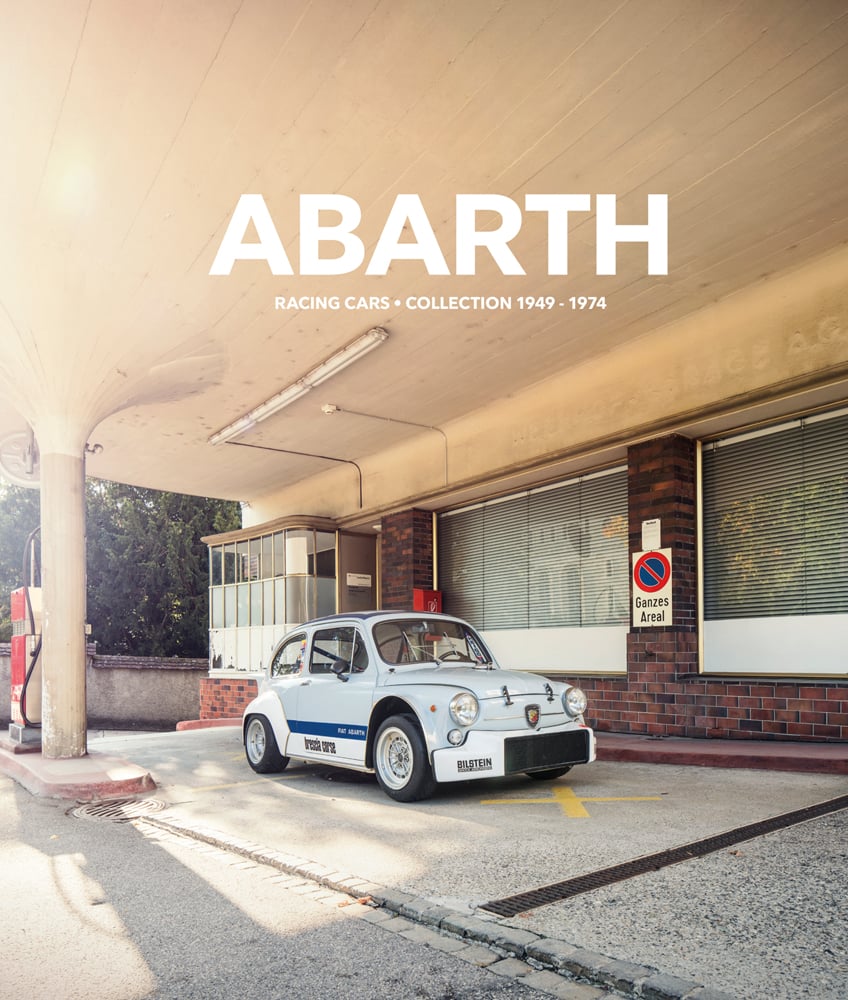 Dark blue cover with vintage orange and beige tax disc to right centre with Forgotten Motoring in white font