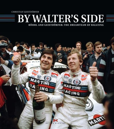 Walter Röhrl and Christian Geistdörfer celebrating on rally car bonnet, with champagne, on cover of 'By Walter's Side, Roehrl and Geistdoerfer: The Dreamteam of Rallying', by Delius Klasing.