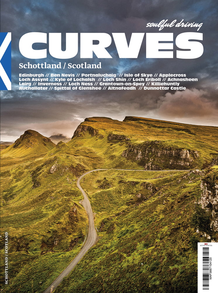 Hilly green landscape, with winding road, under moody sky, on cover of 'Curves Scotland, Number 8', by Delius Klasing.