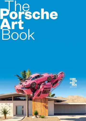 5 pink Porsche 911 models, wrapped in netting, suspended in mid air over building, The Porsche Art Book in white font above on blue cover