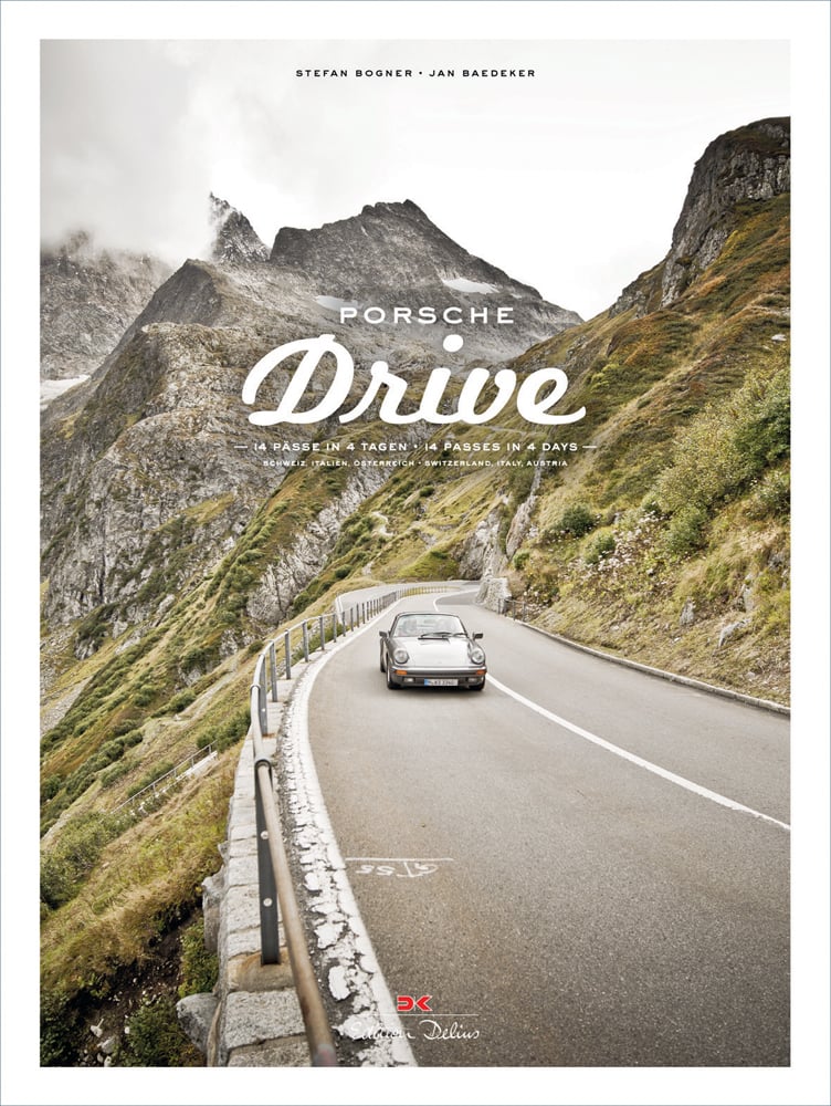 Porsche 911 on winding road surrounded by mountains, on cover of 'Porsche Drive, 15 Passes in 4 Days; Switzerland, Italy, Austria', by Delius Klasing.