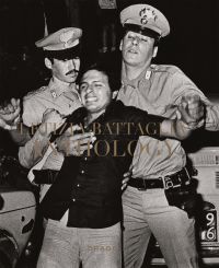 Letizia Battaglia, son of Mafia victim held by two Italian carabinieri as he tries to approach the scene, on cover of 'Letizia Battaglia: Anthology', by Drago.