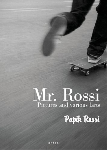 Feet of skateboarder skating away from camera, on cover of 'Mr Rossi, Pictures and Various Farts', by Drago International Entertainment.