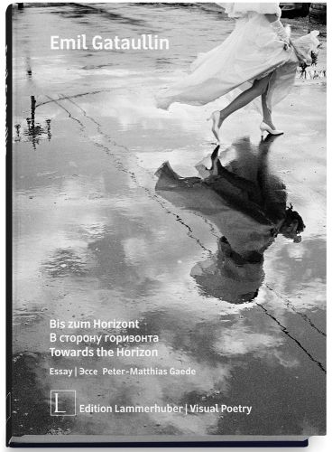 Woman in long white dress, walking across a wet road, on cover of 'Towards the Horizon', by Edition Lammerhuber.