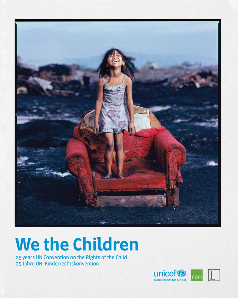 Smokey Mountain - Children of a charcoal burners' camp in Manila; child standing on burnt red armchair, on cover of 'We the Children', by Edition Lammerhuber.