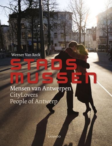 A couple dance in the middle of road, on cover of 'CityLovers: People of Antwerp', by Lannoo Publishers.