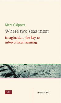 Stone carved with writing and symbols, on cover of 'Where Two Seas Meet, Imagination, The Key to Intercultural learning', by Lannoo Publishers.