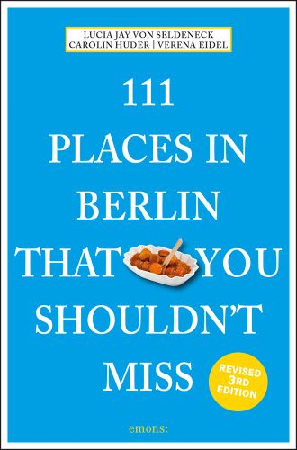 Dish of chopped Bratwurst sausages near centre of bright blue cover of '111 Places in Berlin That You Shouldn't Miss', by Emons Verlag.