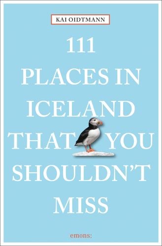 Puffin near centre of sky blue cover of '111 Places in Iceland That You Shouldn't Miss', by Emons Verlag.