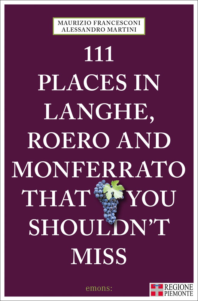 Bunch of black grapes near centre of aubergine cover of '111 Places in Langhe, Roero and Monferrato That You Shouldn't Miss', by Emons Verlag.