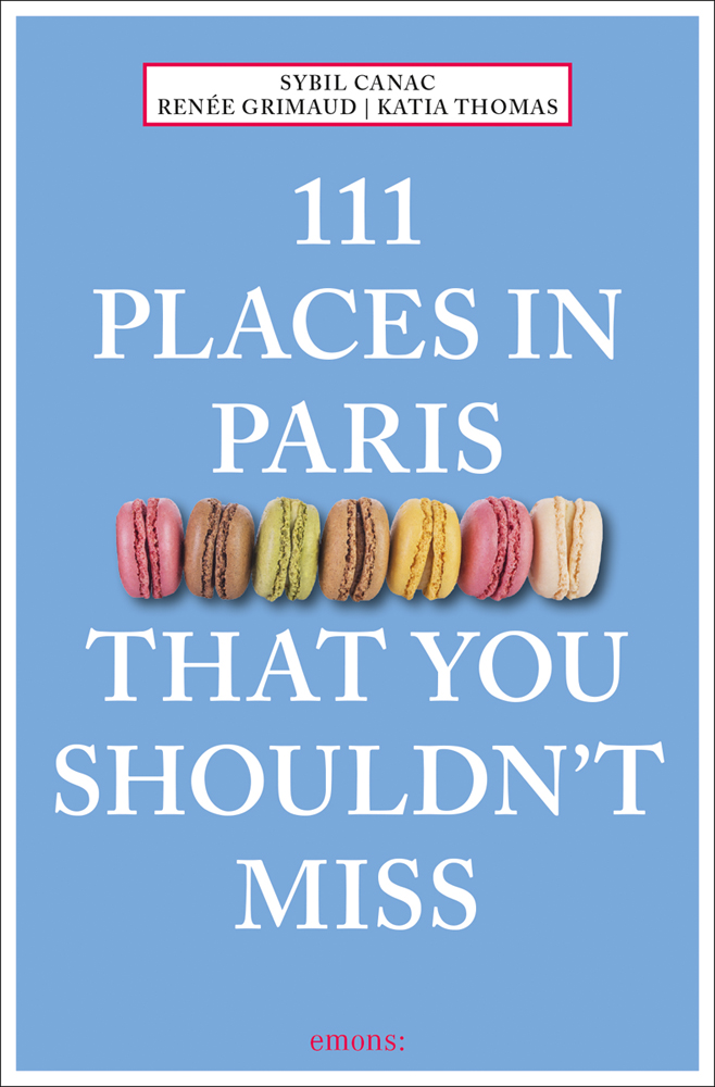 Seven colored macarons to center of sky blue cover of '111 Places in Paris That You Shouldn't Miss', by Emons Verlag.