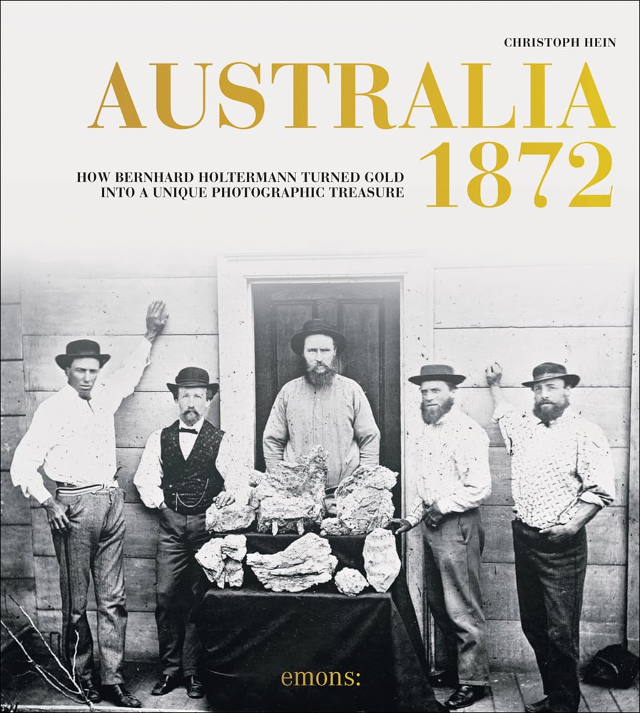 Bernhard Holtermann poses with colleagues and nuggets on cover of 'Australia 1872, How Bernhard Holtermann turned gold into a unique photographic treasure', by Emons Verlag.