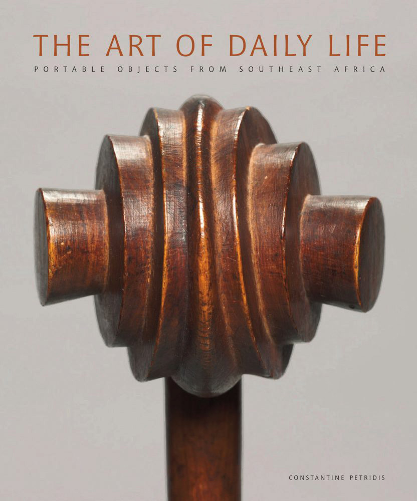 Grey book cover of The Art of Daily Life, Portable Objects from Southeast Africa, featuring the carved head of wooden club (“Knobkerrie”) from Swaziland. Published by 5 Continents Editions.