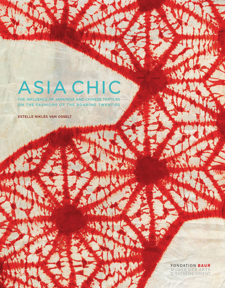 Red floral geometric pattern on off white fabric, ASIA CHIC in pale blue font above
