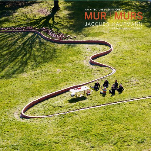 Aerial shot of snaking low ceramic wall in museum grounds, group of people sitting together, MUR L MURS. JACQUES KAUFMANN, CERAMIC ARCHITECTURE in white and orange font above.