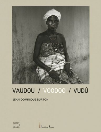 Beige cover of Voodoo, featuring a black female sitting with fabric wrapped around her body, published by 5 Continents Editions.