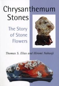 Book cover of Chrysanthemum Stones: The Story of Stone Flowers, with two large natural minerals with flowers. Published by Floating World Editions.
