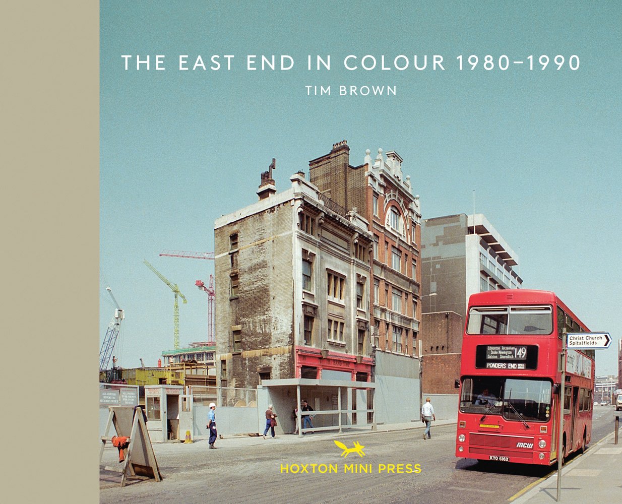 Bishopsgate, 1988, with high storey building, red bus packed by side of road, on landscape cover of 'The East End In Colour 1980-1990', by Hoxton Mini Press.