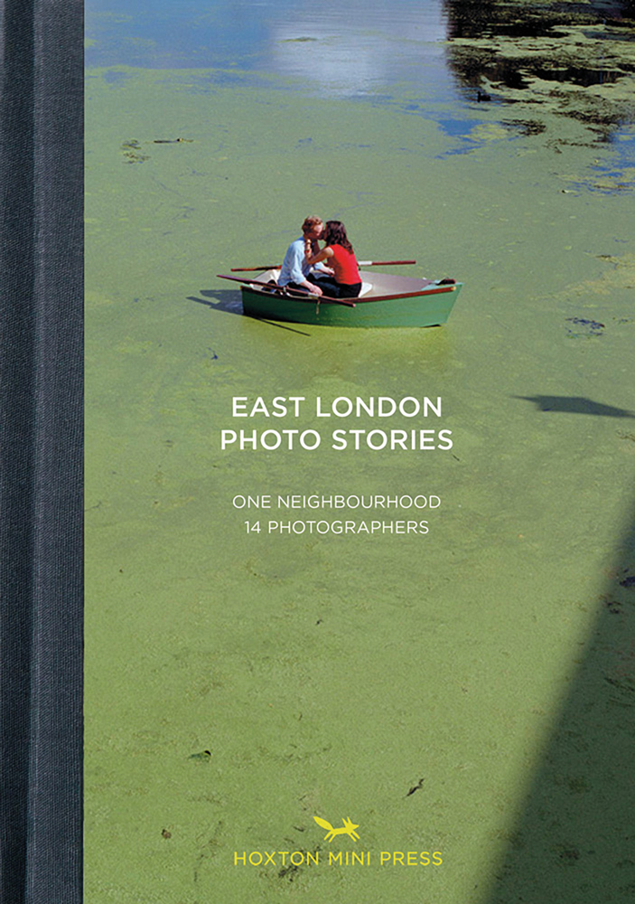 Couple kissing in boat floating on algae-covered Hackney Marshes, on cover of 'East London Photo Stories, One Neighbourhood, 14 Photographers', by Hoxton Mini Press.