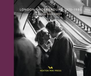 White couple about to kiss each other near escalator, on landscape cover of 'London Underground 1970-80', by Hoxton Mini Press.