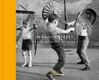 Book cover of Paradise Street, with three children playing with bin lids, handmade swords and a bow and arrow. Published by Hoxton Mini Press.