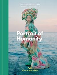 Book cover of Portrait of Humanity, 200 Photographs That Capture the Changing Face of Our World, with child in floral headdress and floral dress, seascape behind. Published by Hoxton Mini Press.