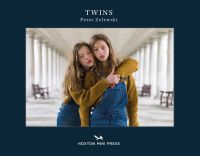 Book cover of Peter Zelewski's Twins, with two female twins wearing blue dungarees in an embrace. Published by Hoxton Mini Press.