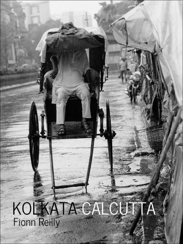 Figure in white sheltering from rain in rickshaw, Kolkata Calcutta in black and white font below