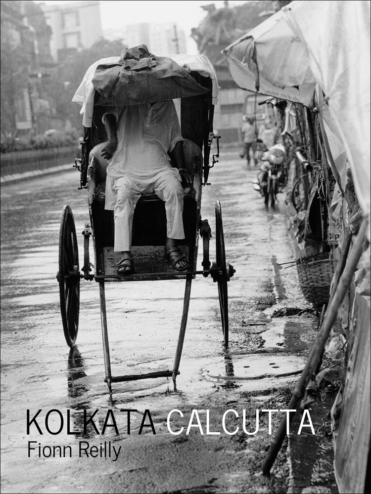 Figure in white sheltering from rain in rickshaw, Kolkata Calcutta in black and white font below