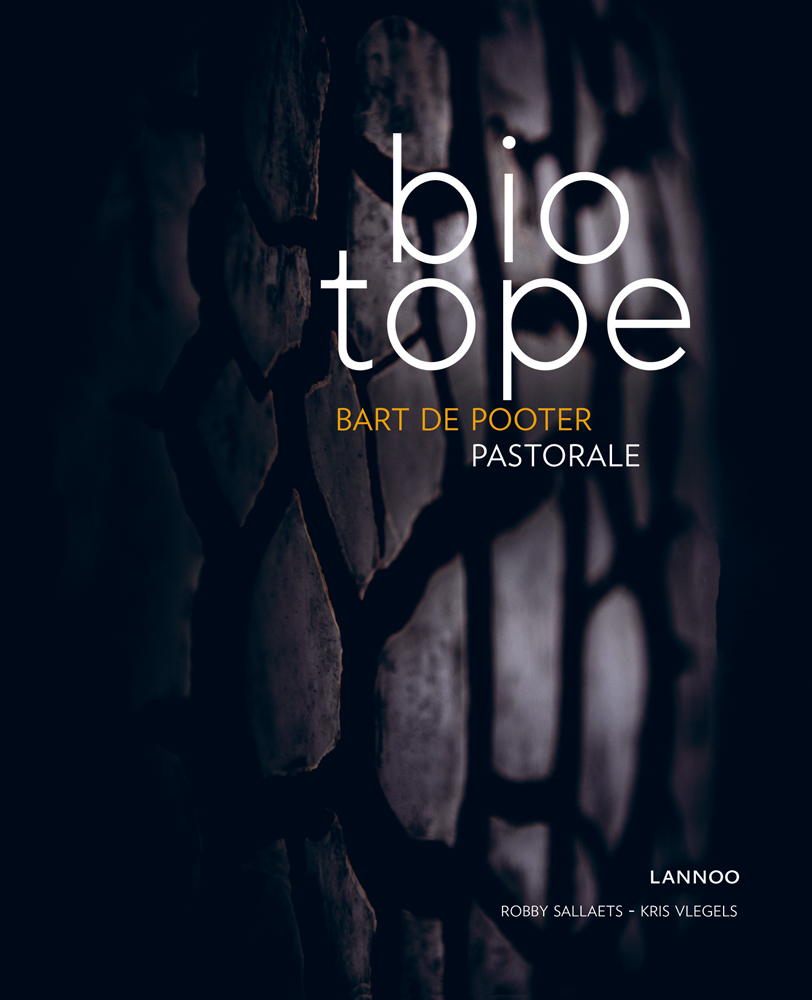 Close up of dark textured aubergine colour vegetable, on cover of 'Biotope, Pastorale', by Lannoo Publishers.