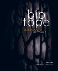 Close up of dark textured aubergine color vegetable, on cover of 'Biotope, Pastorale', by Lannoo Publishers.