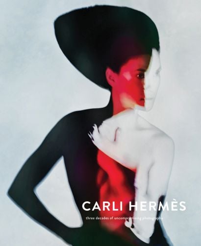 Silhouette of fashion model with red and white graphics, on cover of 'Carli Hermès', by Lannoo Publishers.