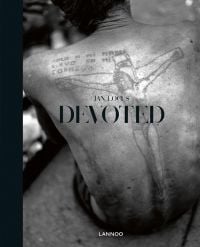 Tattoo of Christ on the cross, on a person's back, on cover of 'Devoted', by Lannoo Publishers.