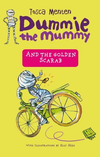 Mummy riding bike wearing gold scarab necklace, on yellow cover, Dummie the Mummy and the Golden Scarab in purple font above.