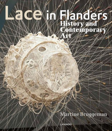 Bucket hat made from ivory lace suspended with lines of thread, on cover of Lace in Flanders, History and Contemporary Art', by Lannoo Publishers.