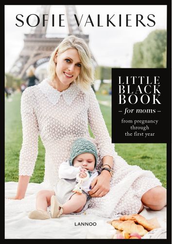 Sofie Valkiers in white collared dress, baby resting on thigh, Eiffel Tower behind, Little Black Book for Moms in white font on black box to right edge