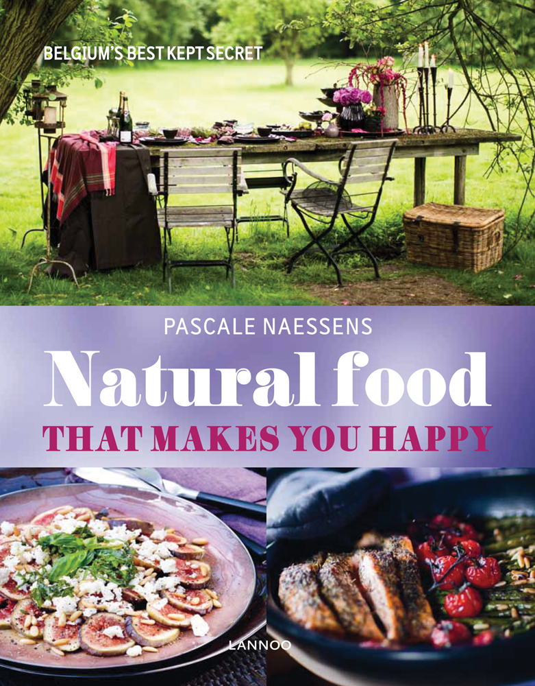 Sliced figs on a plate, wood table and chairs laid with food and drink, on cover of 'Natural Food that Makes You Happy', by Lannoo Publishers.