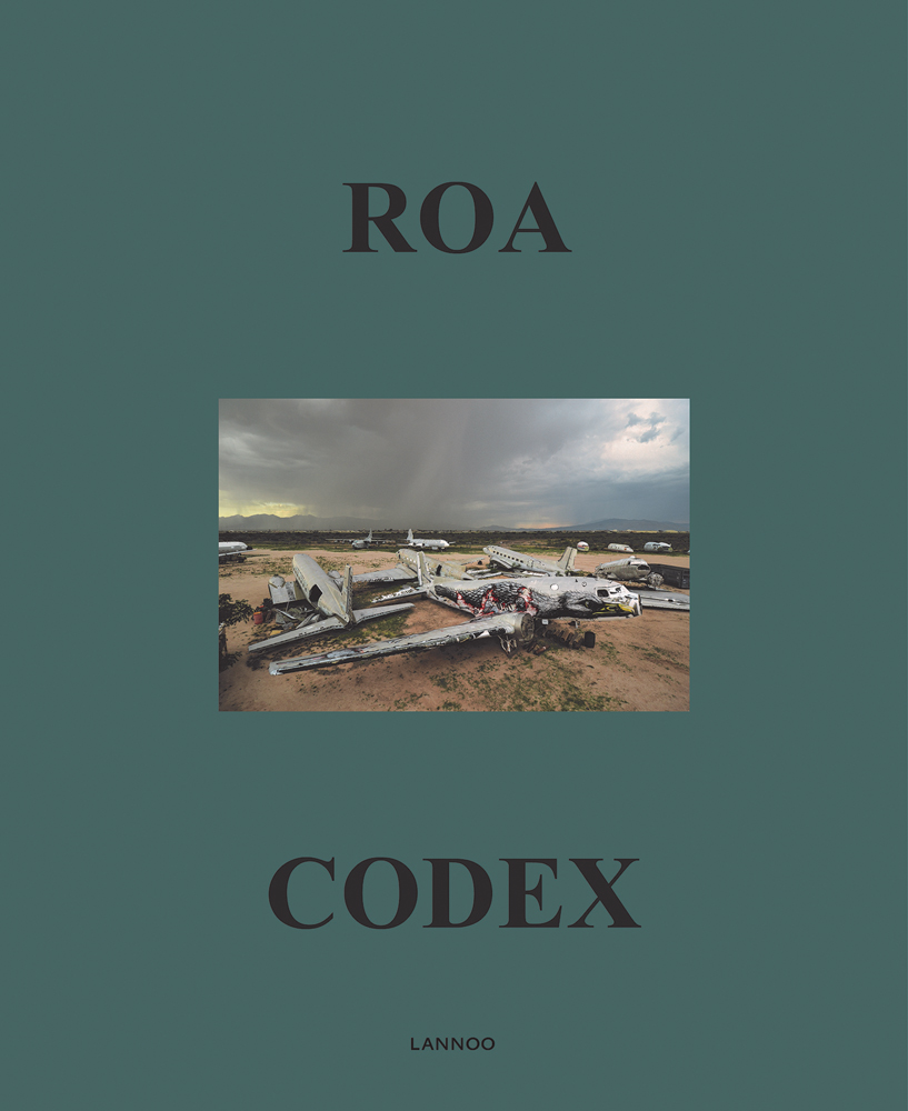 Bald Eagle painted on side of abandoned aeroplane, on green cover of 'ROA Codex', by Lannoo Publishers.