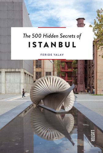 IIhan Koman’s ‘Infinity-Minus-One metal sculpture on plinth, water below, The 500 Hidden Secrets of Istanbul in black font on white banner above