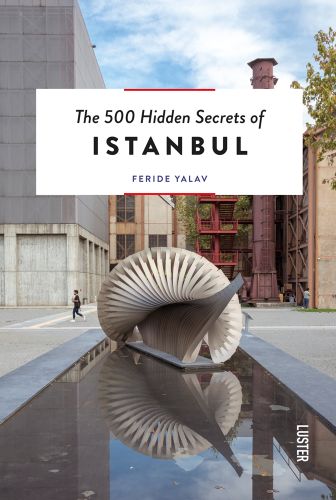 IIhan Koman’s ‘Infinity-Minus-One metal sculpture on plinth, water below, The 500 Hidden Secrets of Istanbul in black font on white banner above
