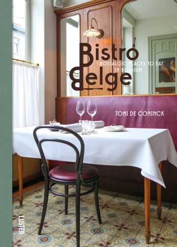 Interior of Belgian café, tiled floor, table with white cloth, 2 wine glasses, Bistro Belge in brown retro font to upper right.