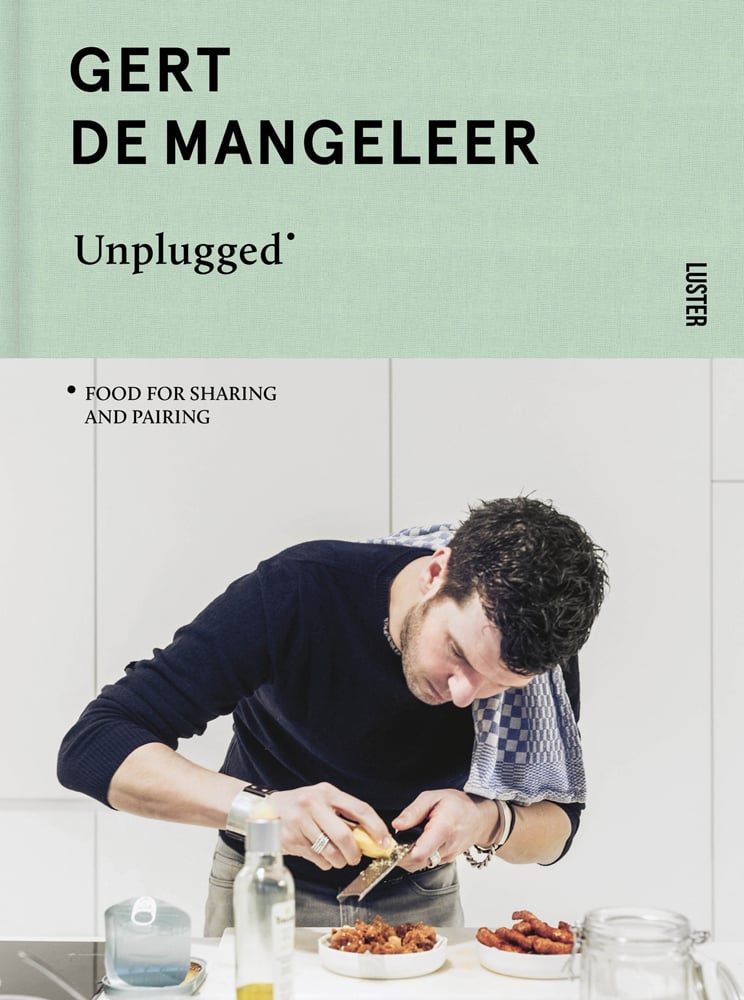 Gert De Mangeleer grating cheese over plated food, tea towel over shoulder, Gert De Mangeleer Unplugged in black on mint green banner to top