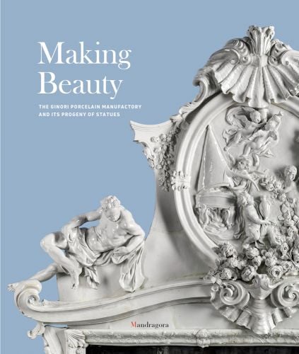 White porcelain fireplace with cherubs, on blue cover of 'Making Beauty, The Ginori Porcelain Manufactory and its Progeny of Statues', by Mandragora.